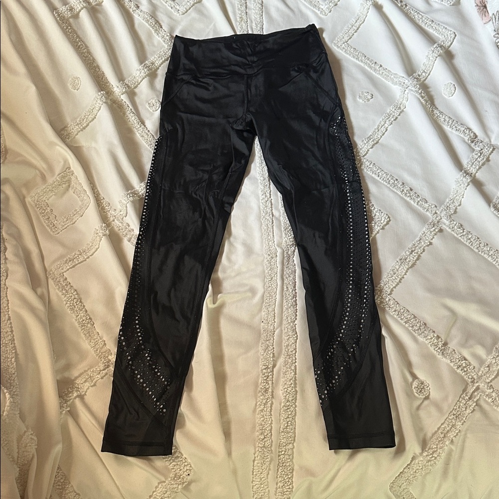 Victoria’s Secret  Black Leggings with lasered hole detail on sides of legs.